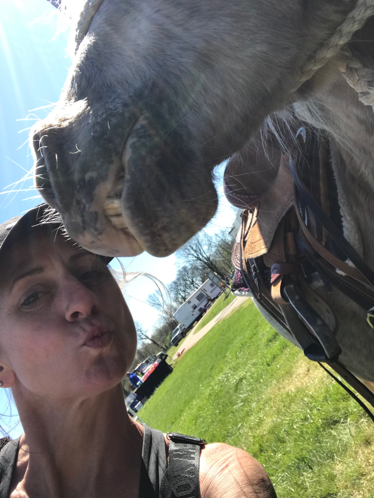 Cara outdoors with her horse on a spring afternoon in Tennessee